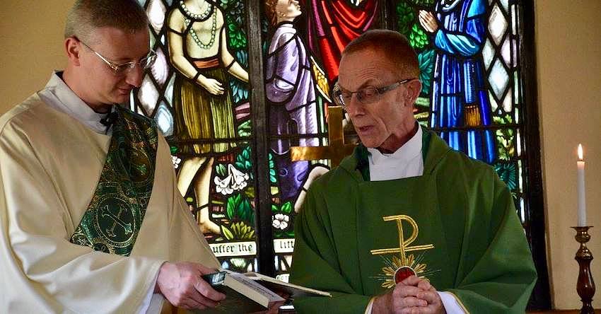 Deacons reading from a book