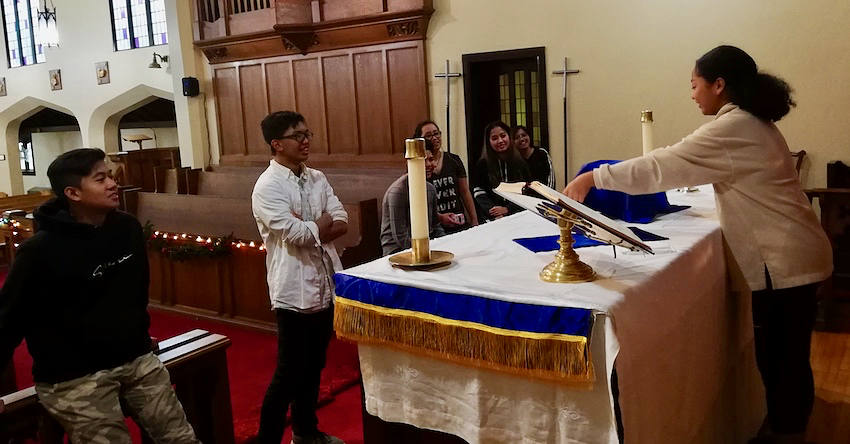 Youth practicing at the alter