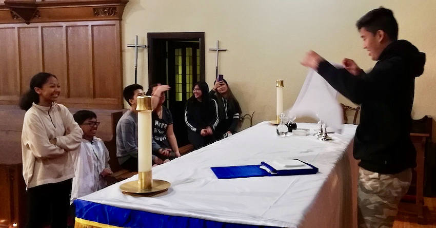 Youth practicing at the alter